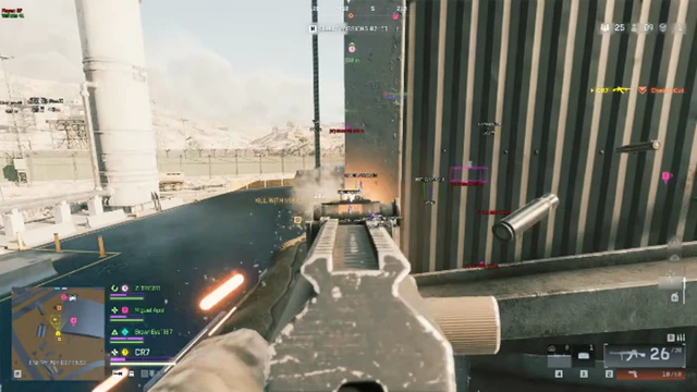 Battlefield 6 snow-covered industrial yard with a white fuel silo while firing an assault rifle at a metal wall.